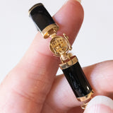 Halbstarres Vintage-Onyx-Armband aus 14-karätigem Gelbgold mit chinesischem Schriftverschluss aus 14-karätigem Gelbgold, 70er Jahre