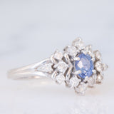 Anello a margherita vintage in platino con zaffiro (0.60ct) e diamanti (0.41ctw), anni ‘90