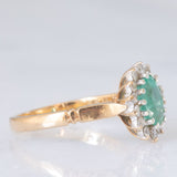 Anello a margherita vintage in oro giallo e bianco 9K con smeraldo (0.70ct ca.) e diamanti (0.20ctw ca.), anni ‘80