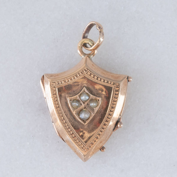 Ciondolo portafoto antico a forma di scudo in oro giallo 9K con perline bianche, primi del ‘900