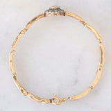Braccialetto semirigido retrò in oro giallo 14K a argento con zaffiro (1ct ca.) e diamanti di taglio rosetta (0.36ctw ca.), anni ‘40/‘50