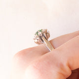 Vintage 14K white gold daisy ring with green tourmaline (0.70ct approx.) and brilliant cut diamonds (0.50ctw approx.), 70s