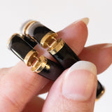 Halbstarres Vintage-Onyx-Armband aus 14-karätigem Gelbgold mit chinesischem Schriftverschluss aus 14-karätigem Gelbgold, 70er Jahre