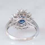 Anello a margherita vintage in platino con zaffiro (1.27ct) e diamanti (0.43ctw), anni ‘80
