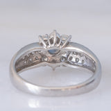 Vintage platinum daisy ring with color-change garnet (approx. 0.35ct) and diamonds (0.58ctw)