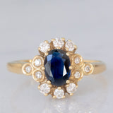 Anello a margherita vintage in oro giallo 14K con zaffiro (0.70ct ca.) e diamanti (0.20ctw ca.), anni ‘80