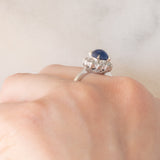 Anello a margherita vintage in platino con zaffiro (1.20ct) e diamanti (0.40ctw), anni ‘70/‘80