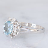 Anello a margherita vintage in platino con acquamarina (1.09ct) e diamanti (0.10ctw), anni ‘80/‘90