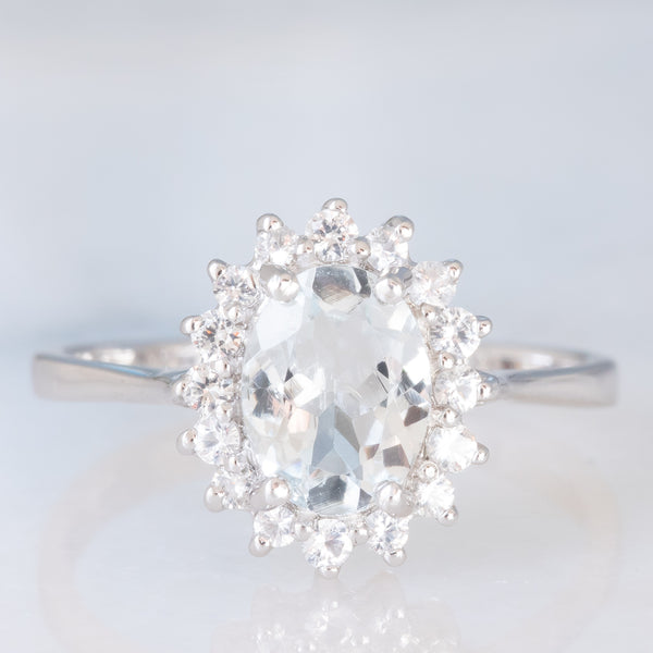 Anello a margherita in oro bianco 9K con acquamarina (1ct ca.) e diamanti di taglio brillante (0.16ctw ca.), anno 2006
