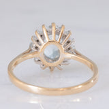 Anello a margherita vintage in oro giallo e bianco 9K con topazio azzurro (1.60ct ca.) e diamanti (0.16ctw ca.), anni ‘80