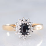Anello a margherita vintage in oro giallo 9K con zaffiro (0.45ct ca.) e diamanti (0.10ctw ca.), anni ‘80