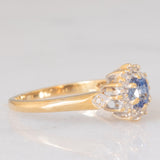 Anello a margherita vintage in oro giallo 9K con zaffiro (0.35ct ca.) e diamanti (0.14ctw ca.), anni ‘80