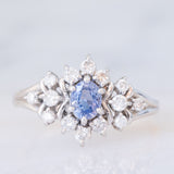 Anello a margherita vintage in platino con zaffiro (0.60ct) e diamanti (0.41ctw), anni ‘90