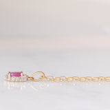 Collana vintage con catenina in oro giallo 9K e con ciondolo a margherita in oro giallo e bianco 9K con rubino (0.40ct ca.) e diamanti