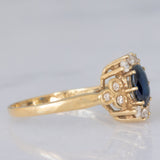 Anello a margherita vintage in oro giallo 14K con zaffiro (0.70ct ca.) e diamanti (0.20ctw ca.), anni ‘80