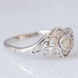 Anello Art Nouveau in oro bianco 18K con diamante di taglio vecchia miniera (0.10ct ca.), anni ‘20/‘30