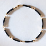 Halbstarres Vintage-Onyx-Armband aus 14-karätigem Gelbgold mit chinesischem Schriftverschluss aus 14-karätigem Gelbgold, 70er Jahre