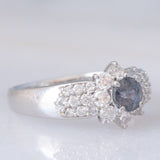 Vintage platinum daisy ring with color-change garnet (approx. 0.35ct) and diamonds (0.58ctw)