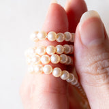 Vintage necklace with string of white pearls and 9K yellow gold clasp, 1985