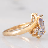 Anello bypass in oro giallo 9K con tanzaniti (0.91ctw ca.) e zaffiri bianchi