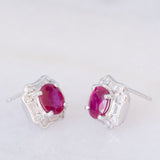 Orecchini a margherita vintage in platino con rubini (1.27ctw) e diamanti (0.50ctw), anni '80