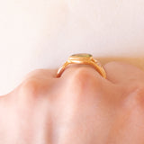 Vintage 18K yellow gold ring with peridot (0.75ct approx.) and diamonds (0.06ctw approx.), 70s/80s