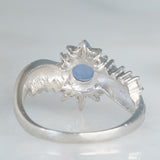 Anello a margherita vintage in platino con zaffiro stellato (0.71ct) e diamanti (0.27ctw), anni ‘80/‘90