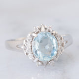 Anello a margherita vintage in platino con acquamarina (1.09ct) e diamanti (0.10ctw), anni ‘80/‘90