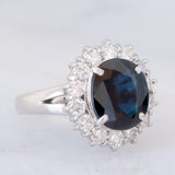 Anello a margherita vintage in platino con zaffiro (4.30ct) e diamanti (1.05ctw), anni ‘80