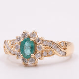 Anel vintage margarida em ouro amarelo 14K com esmeralda (aprox. 0.40 ct) e diamantes lapidação brilhante (aprox. 0.60 ctw), anos 70/80
