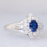 Anello a margherita vintage in platino con zaffiro (0.30ct) e diamanti (0.32ctw), anni ‘80