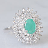 Vintage-Gänseblümchenring aus 14-karätigem Weißgold mit Smaragd (ca. 0.50 ct) und Diamanten (ca. 0.44 ctw), 80er/90er Jahre