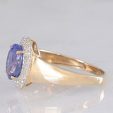 Anello a margherita vintage in oro giallo e bianco 14K con tanzanite (2.10ct ca.) e diamanti (0.30ctw ca.), anni ‘80
