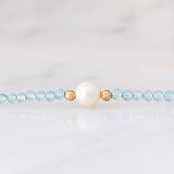 Collana moderna con acquamarine, perla bianca e oro giallo 14K