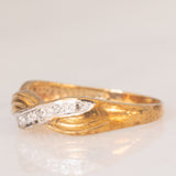 Anello vintage con design intrecciato in oro giallo e bianco 9K con diamanti, anni ‘80/‘90