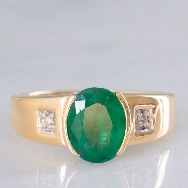 Anello a fascia vintage in oro giallo 9K con smeraldo (2.50ct ca.) e diamanti, anni ‘70/‘80