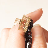 Vintage bracelet with four strands of garnets and 14K yellow gold beaded clasp, 50s/60s