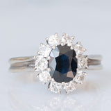 Vintage-Gänseblümchenring aus 18 Karat Weißgold mit Saphiren (ca. 1 ct) und Diamanten im Brillantschliff (ca. 0.60 ctw), 70er Jahre