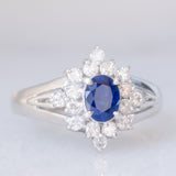 Anello a margherita vintage in platino con zaffiro (0.30ct) e diamanti (0.32ctw), anni ‘80