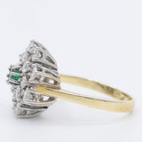 Anello a fiore/fiocco di neve in oro giallo e bianco 14K con smeraldo (0.13ct ca.) e diamanti di taglio brillante (1.24ctw ca.), anni ‘70
