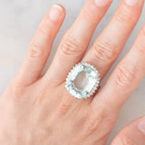 Anello a margherita vintage in platino con acquamarina (17.93ct) e diamanti (1ctw), anni ‘70/‘80