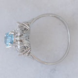 Anello a margherita vintage in platino con acquamarina (0.93ct) e diamanti (0.29ctw), anni ‘80