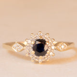 Vintage 9K yellow and white gold daisy ring with sapphire (0.40ct approx.) and diamonds (0.14ctw approx.)