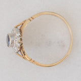 Anello a margherita vintage in oro giallo e bianco 9K con zaffiro (0.60ct ca.) e diamanti (0.12ctw ca.), anno 1991