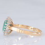 Anello a margherita vintage in oro giallo e bianco 9K con smeraldo (0.70ct ca.) e diamanti (0.20ctw ca.), anni ‘80