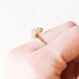 Кольцо из желтого и белого золота 9 карат с синтетическим светло-розовым сапфиром триллионной огранки (около 0.65 карата) и белыми сапфирами, 80-е годы