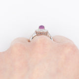 Anello a margherita vintage in platino con rubino stellato (1.35ct) e diamanti (0.66ctw ca.), anni ‘90