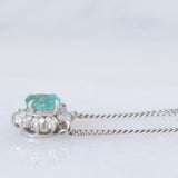 Collier vintage in platino con ciondolo a margherita con smeraldo (0.35ct) e diamanti (0.23ctw)