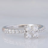 Anello a fiore vintage in platino con diamanti di taglio brillante (0.45ctw), anni ‘90