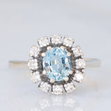 Bague marguerite vintage en or blanc 14 carats avec aigue-marine (environ 0.70 ct) et diamants taille brillant (environ 0.24 ct), années 70